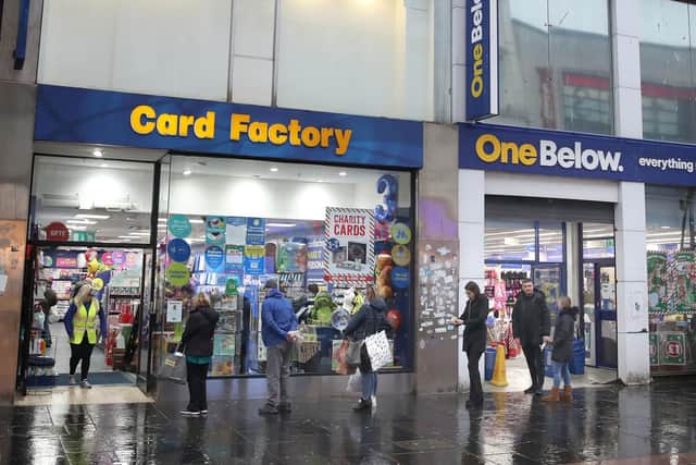 Members of the public queue outside the Card Factory in Glasgow. Eleven local council areas in Scotland will move into level four restrictions from 6pm on Friday to slow the spread of coronavirus. Picture: Andrew Milligan/PA Wire
