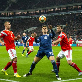 Lawrence Shankland shields the ball from Georgi Dzhikiya during the UEFA European Qualifier against Russia at the Luzhniki Stadium, on October 10, 2019, in Moscow. Scotland lost 4-0 (Photo by Alan Harvey / SNS Group)