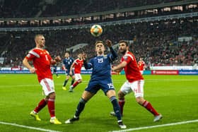 Lawrence Shankland shields the ball from Georgi Dzhikiya during the UEFA European Qualifier against Russia at the Luzhniki Stadium, on October 10, 2019, in Moscow. Scotland lost 4-0 (Photo by Alan Harvey / SNS Group)