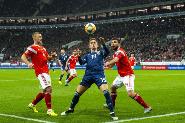 Lawrence Shankland shields the ball from Georgi Dzhikiya during the UEFA European Qualifier against Russia at the Luzhniki Stadium, on October 10, 2019, in Moscow. Scotland lost 4-0 (Photo by Alan Harvey / SNS Group)