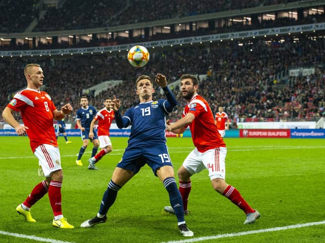 Lawrence Shankland shields the ball from Georgi Dzhikiya during the UEFA European Qualifier against Russia at the Luzhniki Stadium, on October 10, 2019, in Moscow. Scotland lost 4-0 (Photo by Alan Harvey / SNS Group)