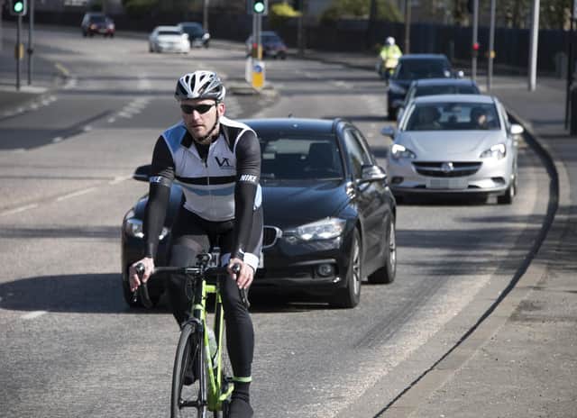Police Scotland stages regular Close Pass operations to encourage drivers to overtake cyclists safely. Picture: Andrew O'Brien