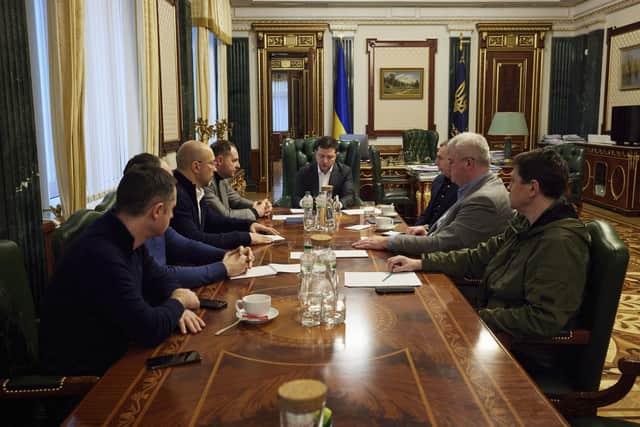 Ukrainian President Volodymyr Zelenskyy (centre) attends an urgent meeting with the leadership of the government, representatives of the defense sector and the economic block in Kyiv, Ukraine. Photo: Ukrainian Presidential Press Office via AP.