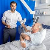 First Minister Humza Yousaf meets patient Paul MacIntosh during a visit to NHS Forth Valley Royal Hospital in Larbert, to mark the 75th anniversary of the NHS.