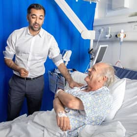 First Minister Humza Yousaf meets patient Paul MacIntosh during a visit to NHS Forth Valley Royal Hospital in Larbert, to mark the 75th anniversary of the NHS.