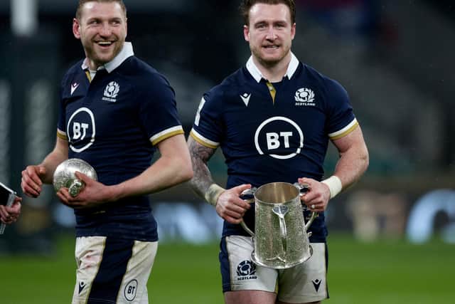 Finn Russell and Stuart Hogg celebrate with the Calcutta Cup after Scotland's 11-6 win over England at Twickenham in 2021. (Photo by Craig Williamson / SNS Group)