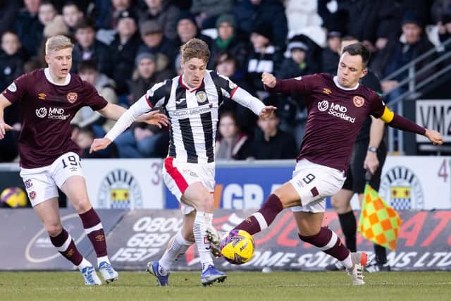 St Mirren's Alex Greive holding off Lawrence Shankland and Alex Cochrane. (Photo by Alan Harvey / SNS Group)