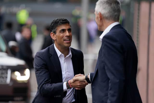 Rishi Sunak (left) is greeted by Director general of the BBC Tim Davie before taking part in the BBC Tory leadership debate live. Picture: Jacob King/PA Wire