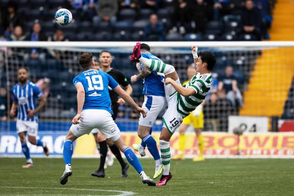 Celtic's Hyeon-gyu Oh with a high tackle on Kilmarnock's Liam Donnelly that earned a yellow card from referee David Dickinson. (Photo by Craig Williamson / SNS Group)