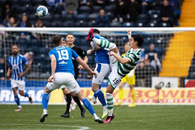 Celtic's Hyeon-gyu Oh with a high tackle on Kilmarnock's Liam Donnelly that earned a yellow card from referee David Dickinson. (Photo by Craig Williamson / SNS Group)