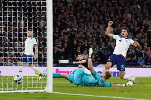 England’s Harry Maguire scores an own goal in the win over Scotland at Hampden Park.