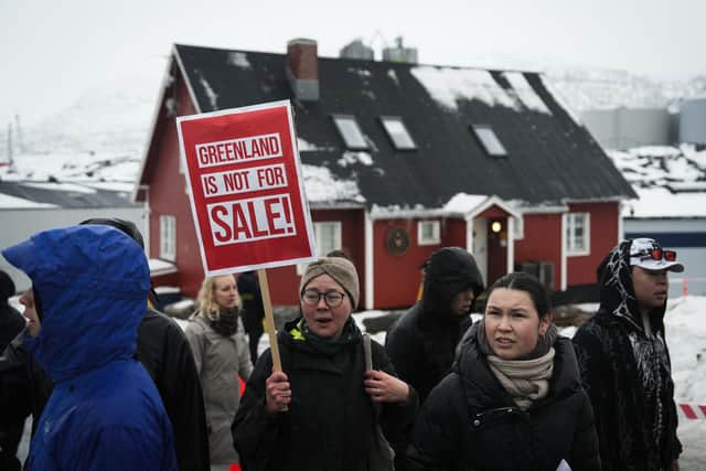 Young people with placards reading 'Greenland is not for sale!' at a demonstration near the US Consulate in Nuuk (Picture: Alessandro Rampazzo/ AFP via Getty Images)