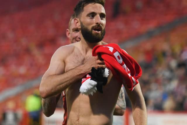 Aberdeen's Graeme Shinnie celebrates as the club secure third place in the Premiership after a 3-0 win over St Mirren at Pittodrie. (Photo by Craig Foy / SNS Group)
