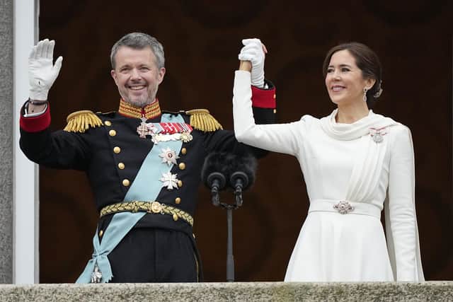 Denmark's King Frederik X and Denmark's Queen Mary wave from the balcony of Christiansborg Palace in Copenhagen, Denmark. Picture: AP Photo/Martin Meissner