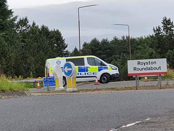 Police closed off a road at the Royston Roundabout this morning after the collision by the Tesco distribution centre. Pic: James Johnston.