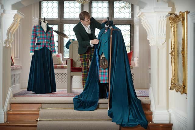 A final inspection of the kilt and cloak to be worn by 'The Buchanan' at the clan chief's inaugration. PIC: Stewart Attwood