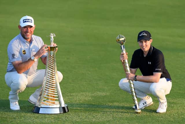 Lee Westwood with the Harry Vardon Trophy and Matt Fitzpatrick with the Dubai Tour Championship trophy after the final round of the DP World Tour Championship at Jumeirah Golf Estates last month. Picture: Ross Kinnaird/Getty Images.