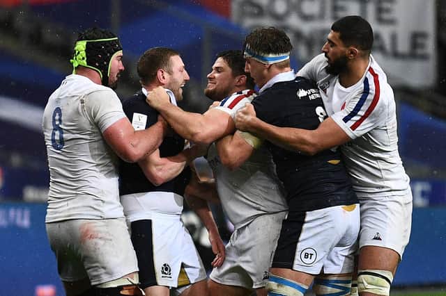 Finn Russell becomes involved in a tete-a-tete against France. The Scotland stand-off was sent off later in the game. Picture: Anne-Christine Poujoulat/AFP via Getty Images