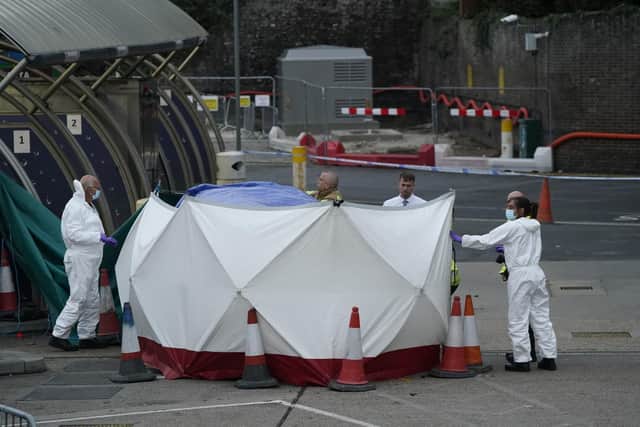 Forensic officers erect a tent around the car allegedly involved in an incident near the migrant processing centre in Dover, Kent. (Pic:  Andrew Matthews/PA Wire)