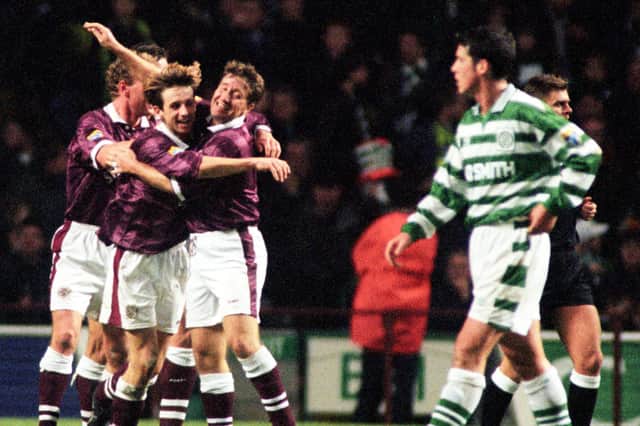 Neil McCann (left) celebrates his goal with Hearts teammate John Robertson in a 2-2 draw with Celtic in November 1996