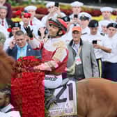 Jockey Sonny Leon aboard Rich Strike celebrates after Rich Strike won the 148th running at Churchill Downs on May 07, 2022 in Louisville, Kentucky.