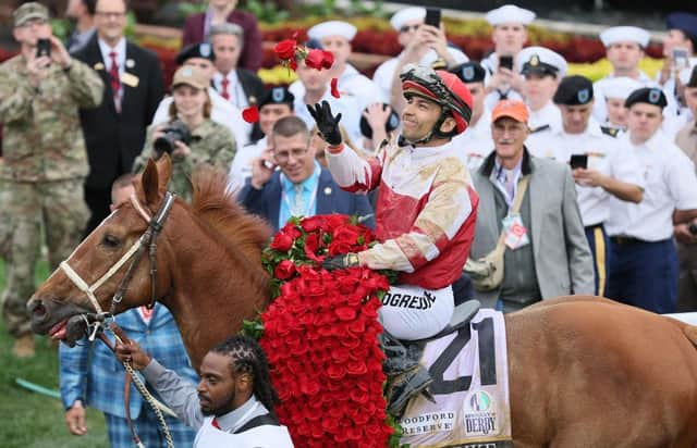 Jockey Sonny Leon aboard Rich Strike celebrates after Rich Strike won the 148th running at Churchill Downs on May 07, 2022 in Louisville, Kentucky.