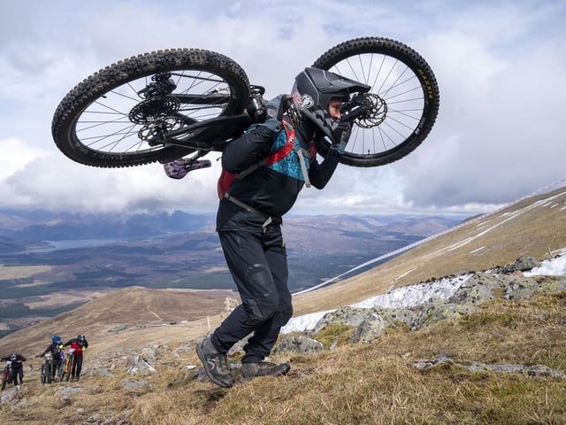 Cyclists climb their way to the start line to compete in MacAvalanche. Jane Barlow/PA Wire
