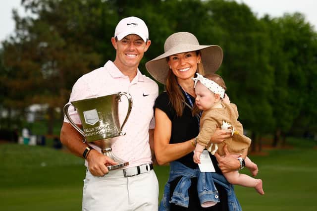 Rory McIlroy celebrates with the trophy alongside his wife Erica and daughter Poppy after winning the 2021 Wells Fargo Championship at Quail Hollow Club in Charlotte, North Carolina. Picture: Jared C. Tilton/Getty Images.