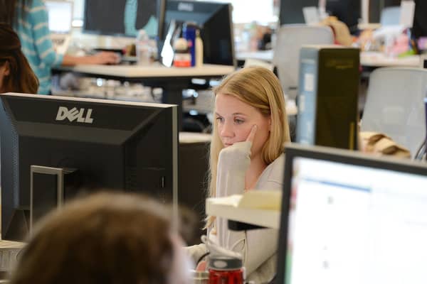 Women outperform men in education, but that's not reflected in the make-up of senior management in office settings (Picture: Robyn Beck/AFP via Getty Images)