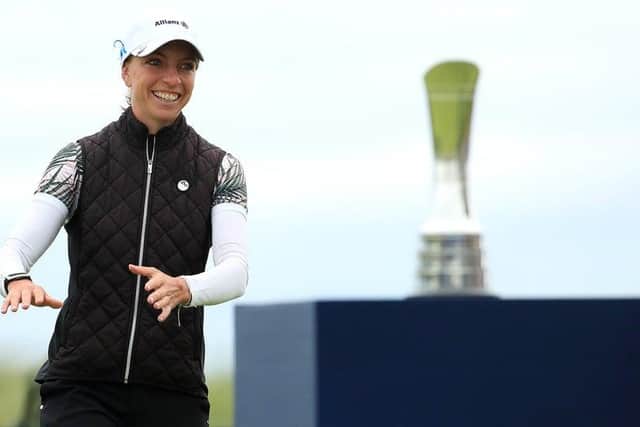 Sophia Popov walks forward to collect her trophy following her two-shot victory in the AIG Women’s Open. Picture: R&A via Getty.