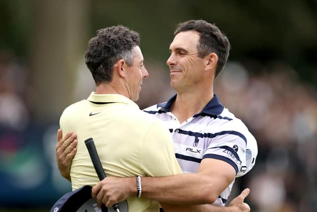 Billy Horschel and Rory McIlroy embrace on the 18th green after the American won a play-off to claim a second win in three years in the BMW PGA Championship at Wentworth Club. Picture: Richard Heathcote/Getty Images.