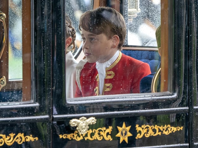 Prince George as the Coronation Procession leaves Westminster Abbey following the coronation ceremony of King Charles III and Queen Camilla in central London.