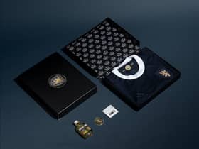 Pictured, the limited-edition version that comes complete with a commemorative coin and commemorative miniature blended malt whisky.