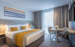 A double room where the colour theme matches the hotel's tones of grey punctuated by yellow. Pic: Contributed