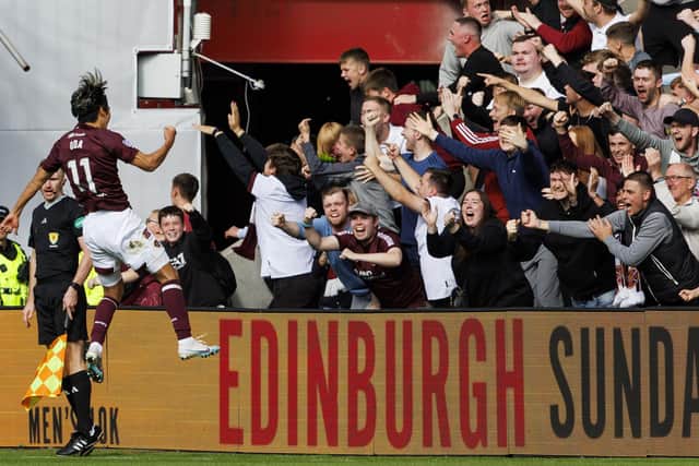 Yutaro Oda takes the acclaim of the Hearts fans after his goal to open the scoring against Aberdeen.