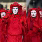 Extinction Rebellion 'Red Rebels' yesterday during the official final day of the Cop26 summit.