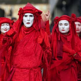 Extinction Rebellion 'Red Rebels' yesterday during the official final day of the Cop26 summit.