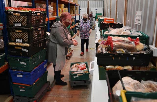 While the rich get richer, more people are depending upon food banks (Picture: Paul Ellis/AFP via Getty Images)