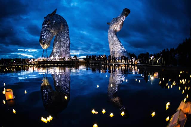 The Kelpies are illuminated as members of the public hold a service of reflection to show their respect to the late Queen Elizabeth II