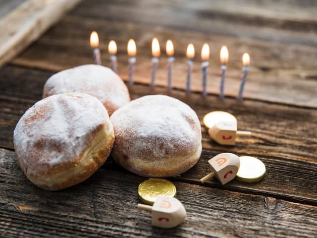The Menorah candlestick holds nine candles, eight of which are lit using the ninth throughout Hanukkah.