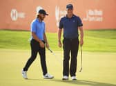 Marc Warren, right, smiles on the 18th green after finishing with a birdie in the Abu Dhabi HSBC Championship at Abu Dhabi Golf Club. Picture: Andrew Redington/Getty Images.