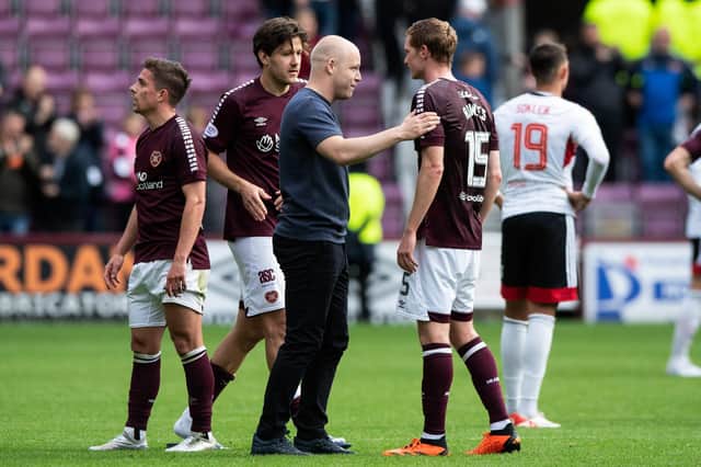 Hearts manager Steven Naismith speaks with Kye Rowles at full time after the 2-0 win over Aberdeen.