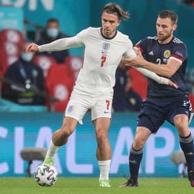 Stephen O'Donnell closely marked Jack Grealish. (Photo by CARL RECINE/POOL/AFP via Getty Images)