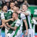 Hibs players celebrate Kevin Nisbet's winner against Hearts.
