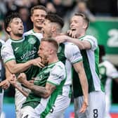 Hibs players celebrate Kevin Nisbet's winner against Hearts.