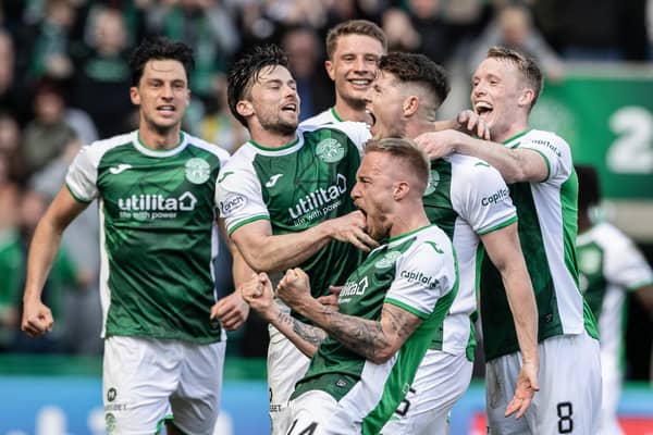 Hibs players celebrate Kevin Nisbet's winner against Hearts.