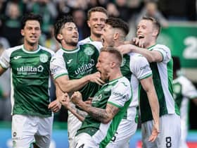 Hibs players celebrate Kevin Nisbet's winner against Hearts.