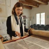 A rabbi reads from a Torah scroll (Picture: Sean Gallup/Getty Images)