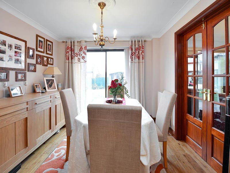 Solid oak floor and double-glazed, sliding patio door leading to the rear garden.