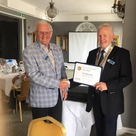Brian  Higgins receiving Paul Harris Fellowship from club president Brian O’Neil